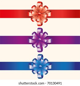 Three bows of red, dark blue and lilac color