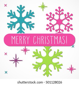 Three bright snowflakes and hand written Christmas greetings in a pink frame, isolated over white.