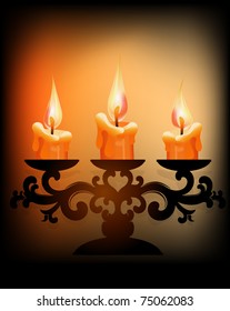 Three burning candles  on dark background