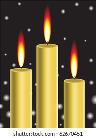 three burning gold candles on a black background with snowflakes