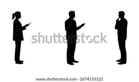 Three business people standing and using their mobile phones in formal attire