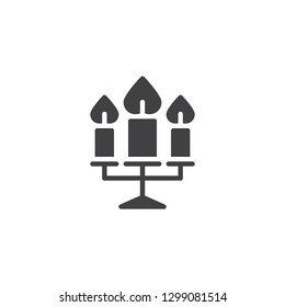 Three candles burning vector icon. filled flat sign for mobile concept and web design. Candelabra with candles simple solid icon. Symbol, logo illustration. Pixel perfect vector graphics