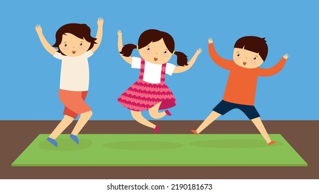 Tres niños saltan sobre el tapete