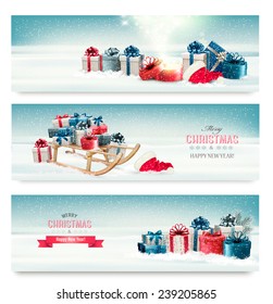 Three Christmas banners with presents and a sleigh. Vector. 