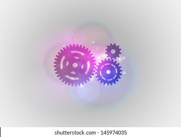 three cogwheels on the soft background