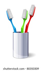 Three Color Toothbrushes In Metal Glass