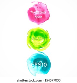 Three colored watercolor spots