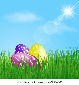 Three colorful Easter Eggs in the grass on sunny sky background. Vector illustration.