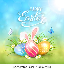 Three colorful Easter eggs with rabbit ears on grass and white flowers. Blue nature background with sun beams in corner and lettering Happy Easter, illustration.