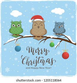 Three colorful owls with Santa's hat on branch with snow and colored Christmas balls. Lettering Merry Christmas and Happy New Year on blue winter background, illustration.