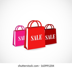 Three colorful paper shopping bags with basket icon vector