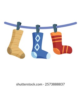 Three colorful socks are hanging on a clothesline, drying after being washed