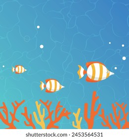 Three colorful striped tropical fish swim in the red coral reef, where the tranquil blue of the sea complements the sunlight filtering through the water.