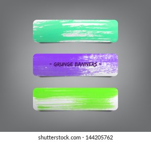 Three colorful vector paper banners / labels / tags with brush stroke hand painted / watercolor stains background. Grunge style