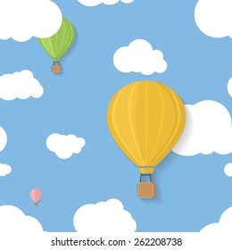 Three coloured aerostats in blue skies with clouds flat seamless pattern