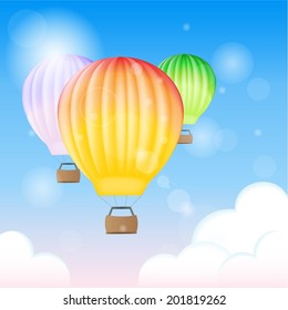 Three colourful balloons in the sky 