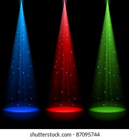Three conical RGB shafts of light shines a spotlight into the black