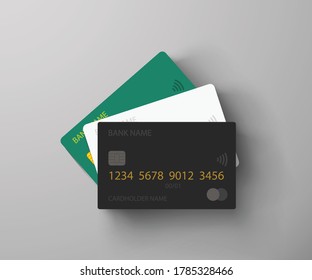 three credit cards lying on grey background