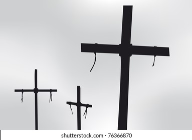 Three Crosses in silhouette in front of a gray sky