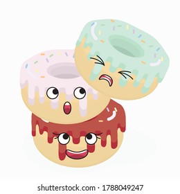 Drei süße Donuts schauen sich an, während sie in Form eines instabilen Turms stehen.