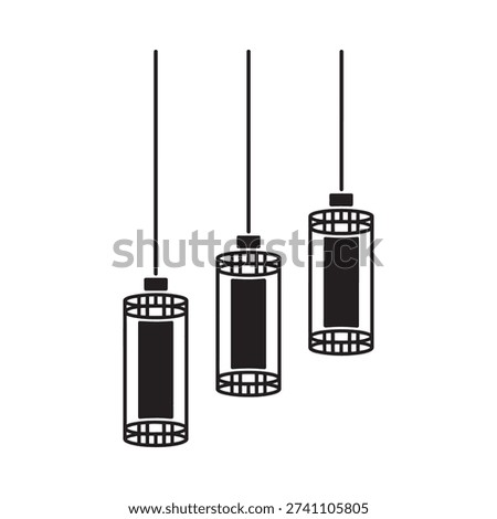 Three cylindrical pendant lights hanging from the ceiling