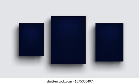 three dark blue boards on grey wall