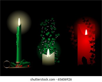 Three decorative candles with holly mistletoe and ivy
