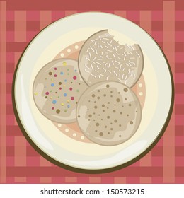 three delicious cookies with dots within it in a textured background