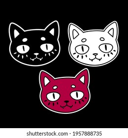 three different colors of cat heads