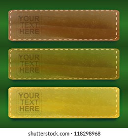 Three different colors leather texture banners over green background