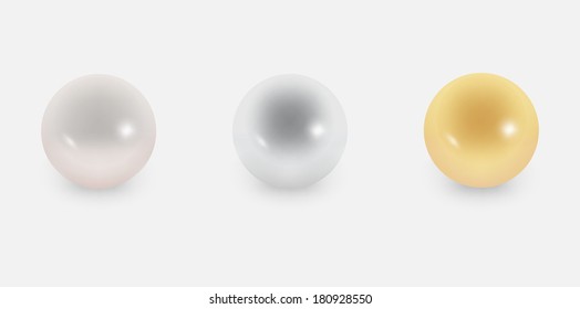 Three different pearls on the grey background
