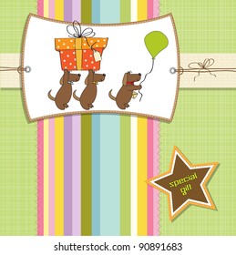 three dogs that offer a big gift. birthday greeting card