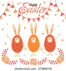Three Easter Bunny among beautiful flowers.