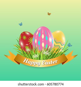 Three Easter eggs with butterfly grass flower and gold ribbon.