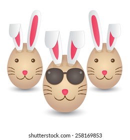 Three Easter eggs painted with rabbit faces and taped with paper rabbit ears. vector.
