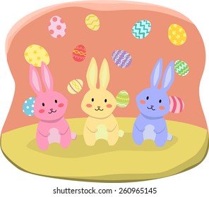 Three Easter Rabbit with colorful easter eggs background.