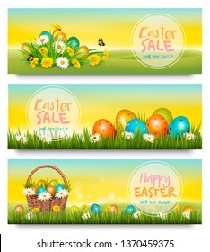 Three Easter Sale banners. Colorful eggs in green grass and spring flowers. Vector.