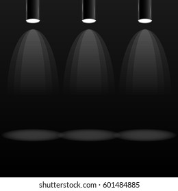 Three electric searchlights isolated on black background