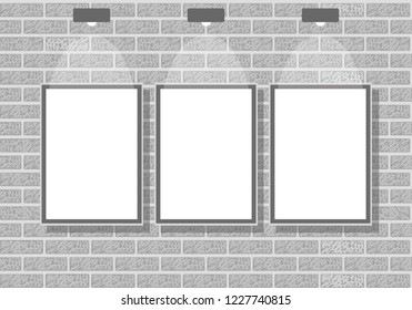 three empty picture frames on the brick wall