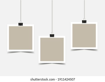 Three empty Square photo frames with border hanging on binder clips. beige photo cards on ropes with a shadow. Mockup. Vector 3d realistic. blank template. EPS10.