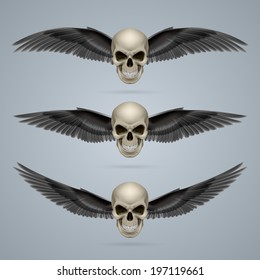 Three evil looking ivory coloured two-winged skulls.