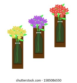 three flowers in bottle shaped vase