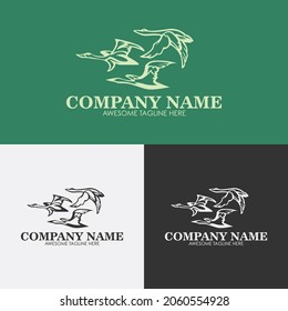 Tres modelos de diseño del logotipo de los cisnes volantes con tres variantes de color de negro, blanco y verde