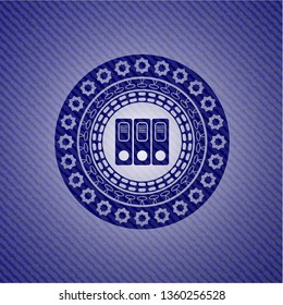 three folders icon inside badge with jean texture