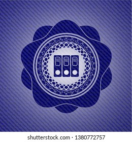three folders icon inside badge with denim texture