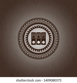 three folders icon inside badge with wood background