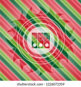 three folders icon inside christmas colors style emblem.