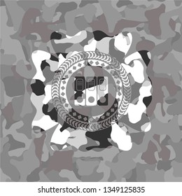 three folders icon inside grey camouflage emblem