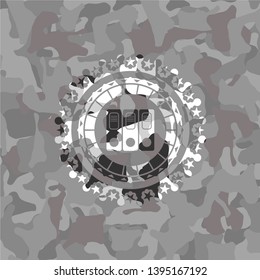 three folders icon inside grey camouflaged emblem