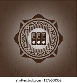 three folders icon inside realistic wooden emblem